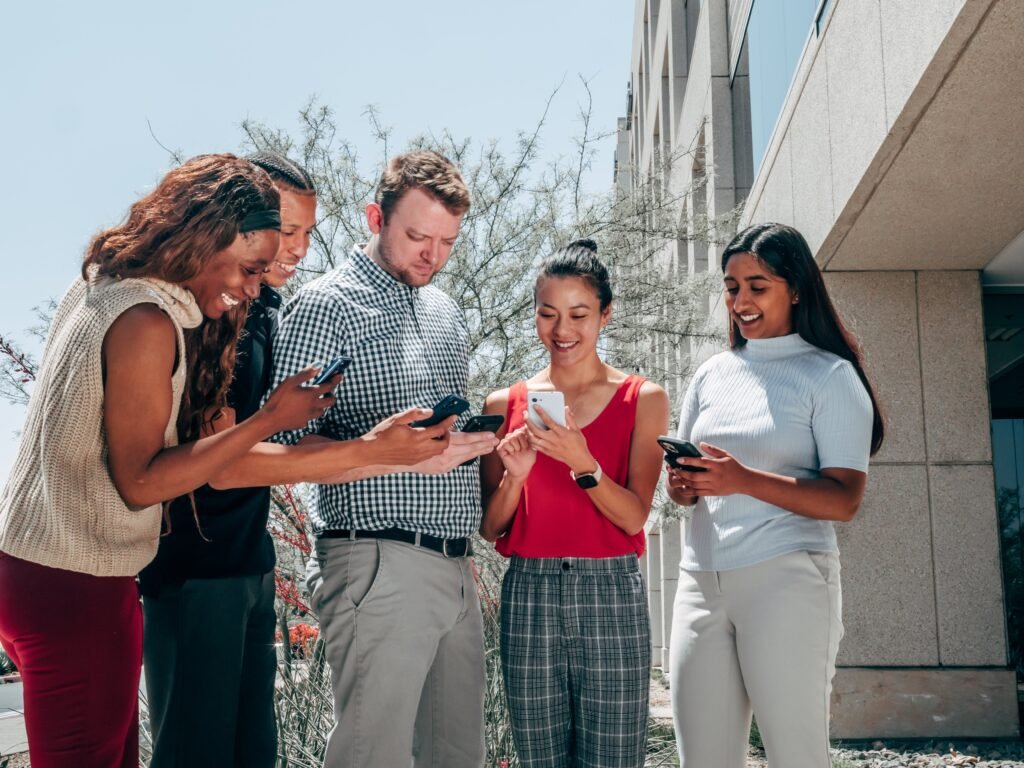 group of people using cellphones